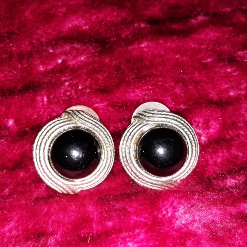 Pair of black and gold pierced earrings